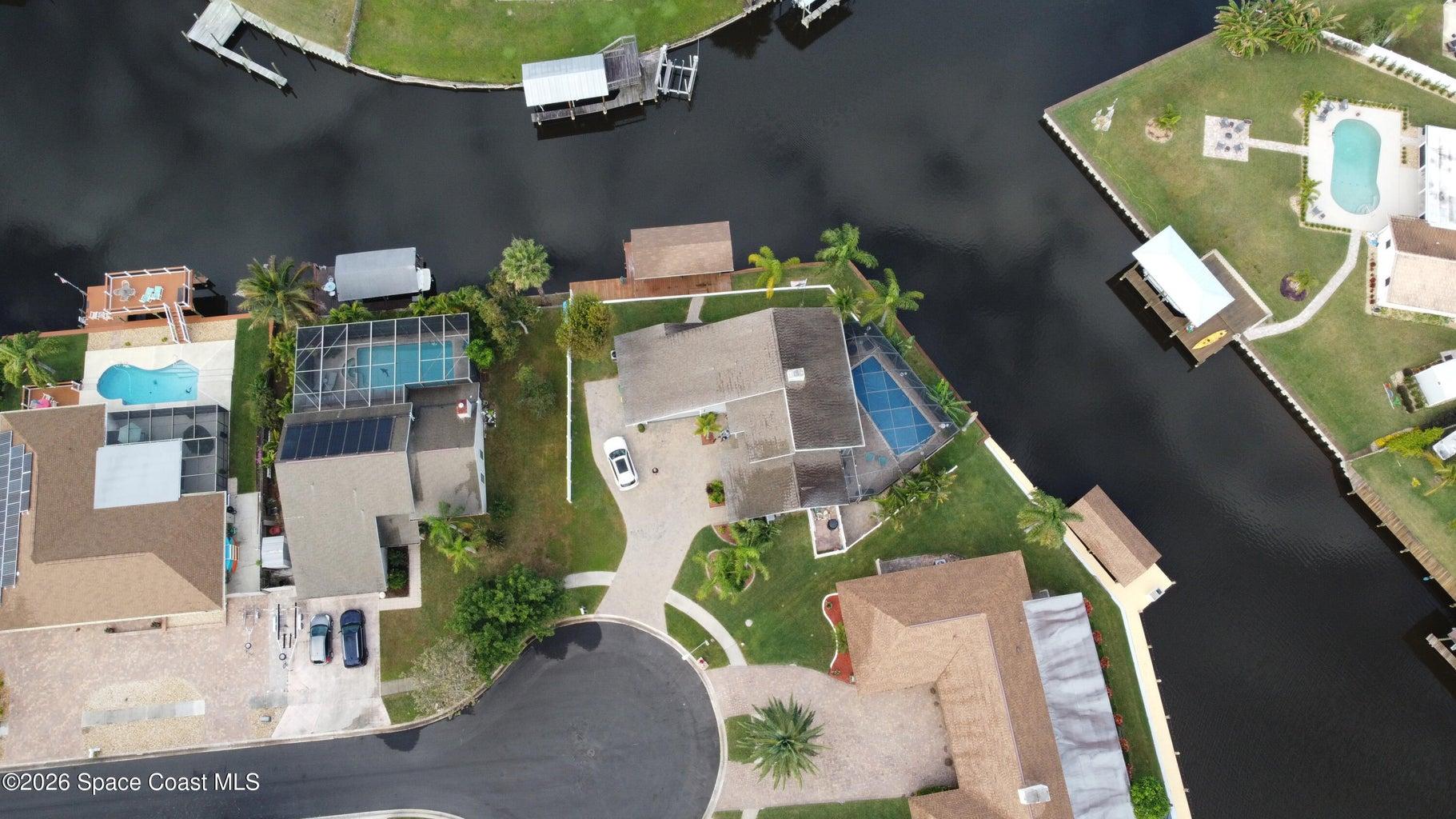 Dramatic 200+ degree Panoramic water canal and sky views from the living & dining rooms, the pool and boat dock.