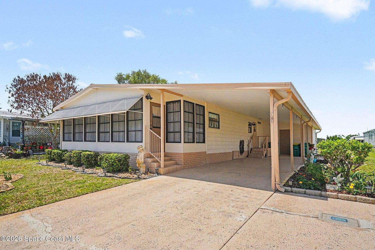 Two entrance, one in the sunproce, the other through the laundry room. Large attached Shed to rear of carport.