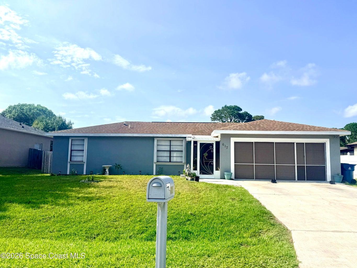 Outdoor living at its best!This charming home features a screened summer kitchen and extended patio/deck,fenced backyard with room for a pool