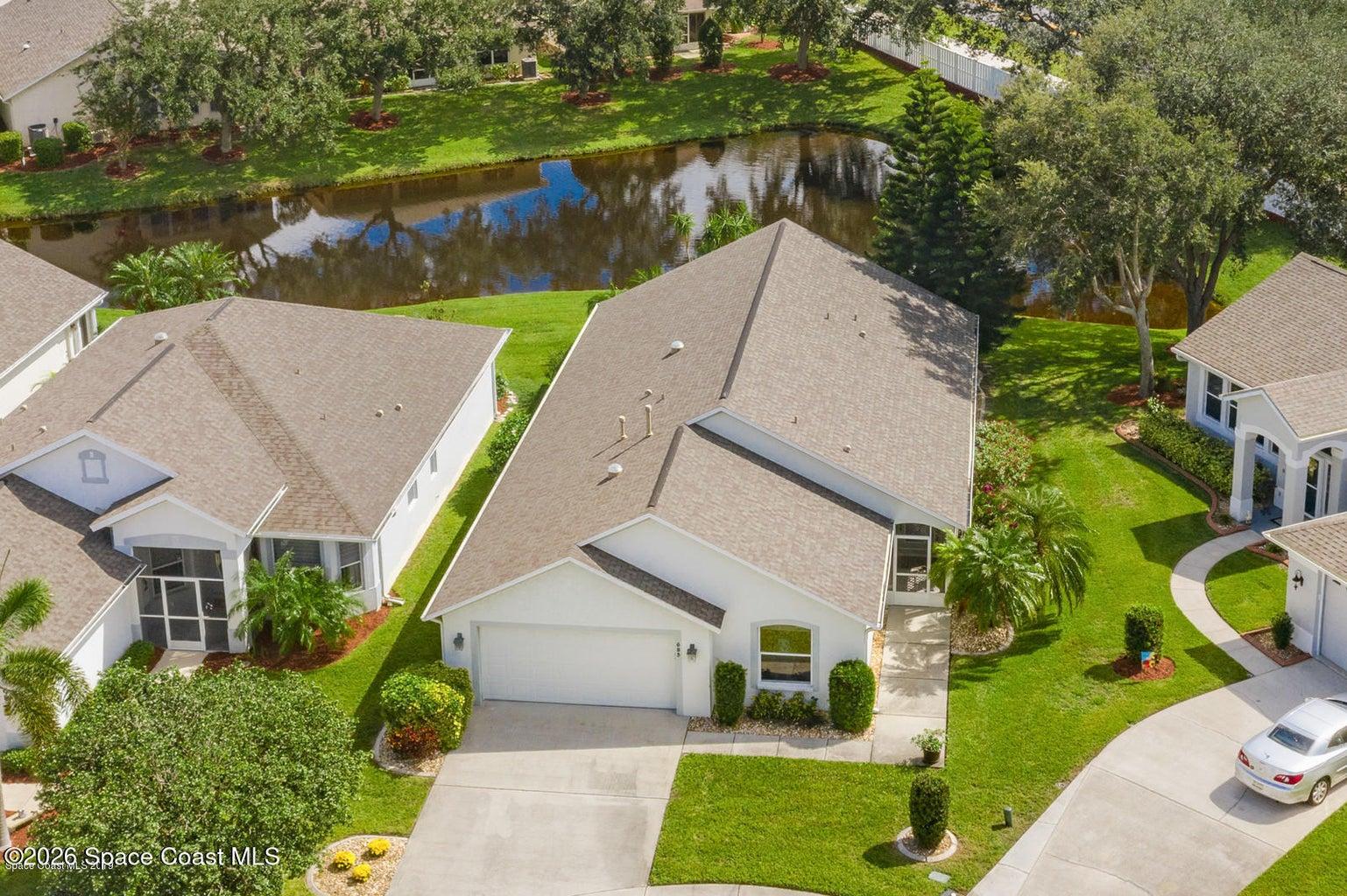 Located in West Melbourne in Compass Pointe 55+. Equipped with Impact windows!