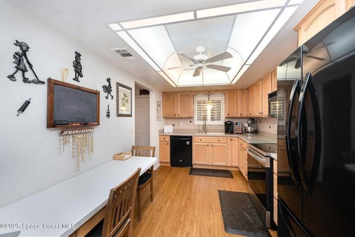 Kitchen area with built office space or eat-in area