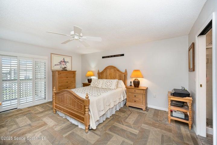 Primary bedroom with plantation shutters on the sliding doors