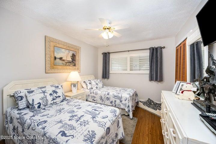Guest bedroom also has plantation shutters