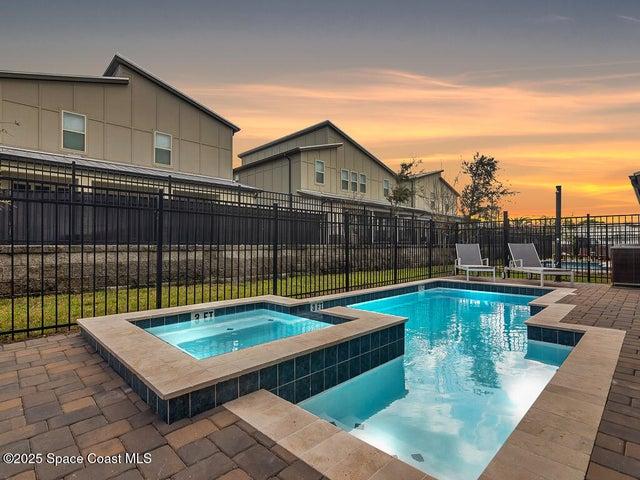 Evening Pool View. Heated with Jacuzzi and paver decking.