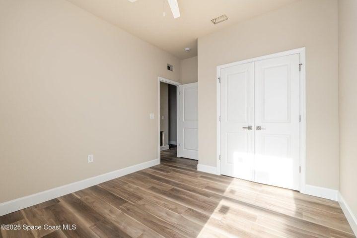 Guest bedroom with double closet doors