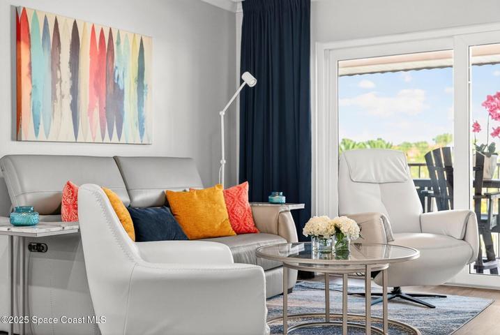 Custom modern furniture with hurricane impact sliders and windows.