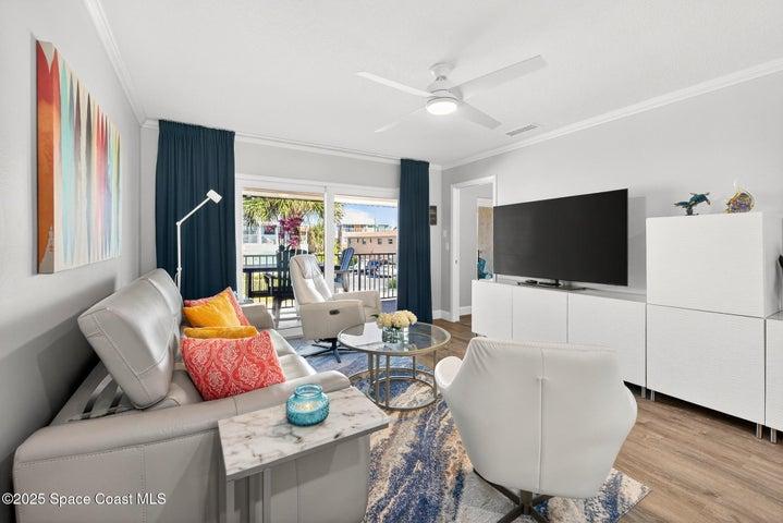 Custom modern furniture with hurricane impact sliders and windows.