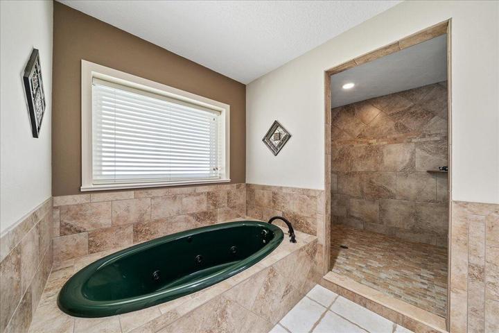 Primary bathroom with huge walk-in double showerheads