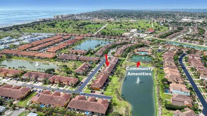This expansive view showcases the home's ideal proximity to the neighborhood's premier features, with the clubhouse and playground just a short, scenic stroll away.