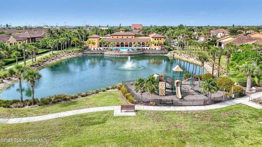Enjoy an enriched lifestyle with access to the community's private clubhouse and a fun-filled playground, all set against a backdrop of lush landscaping and peaceful water views.