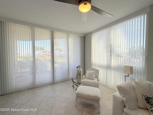 10' ceilings with Hunter Douglas electrical blinds in living room