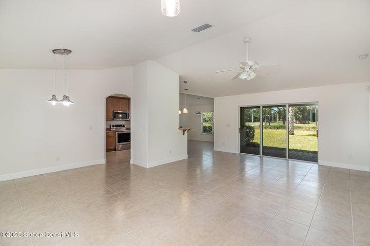 Gorgeous Open Concept Great Room, Vaulted Ceilings, Natural Light and Neutral Tile Flooring...