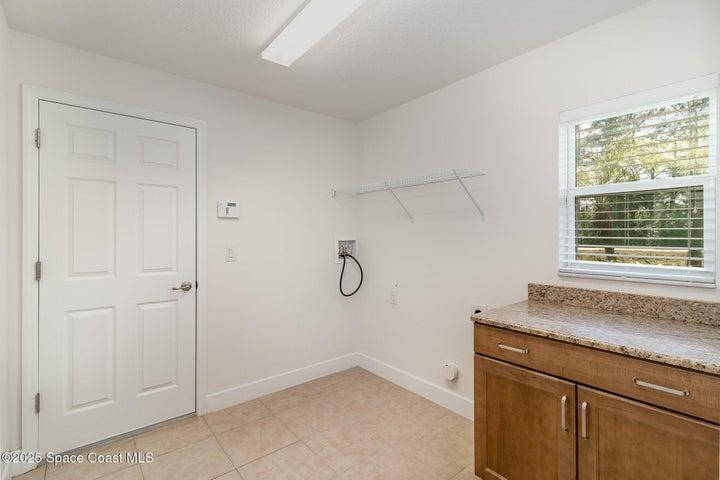 Indoor Laundry Room with Window and Cabinet...with GRANITE!!!