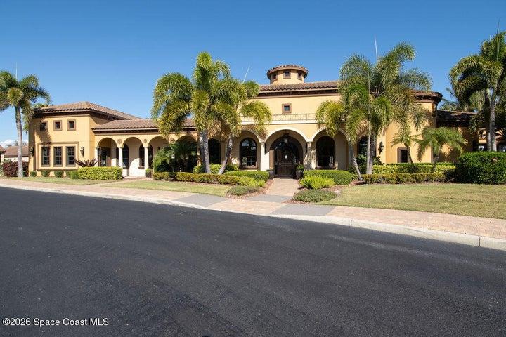 Luxurious community clubhouse with tropical landscaping.