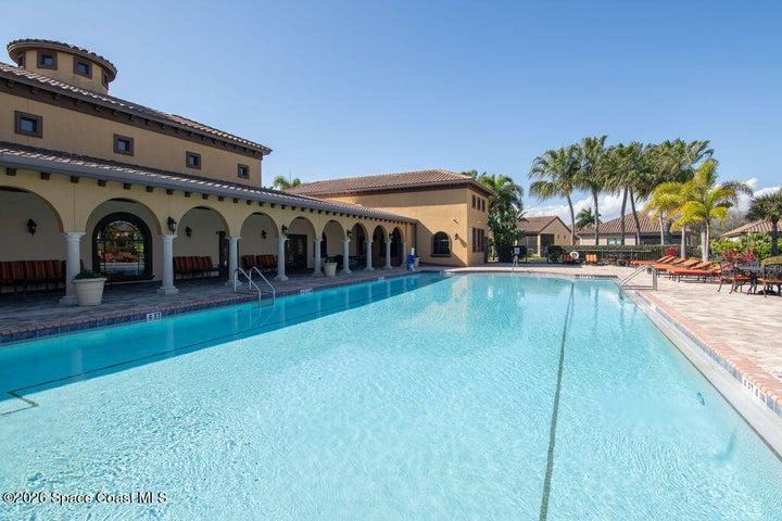 Pristine community pool with water views.