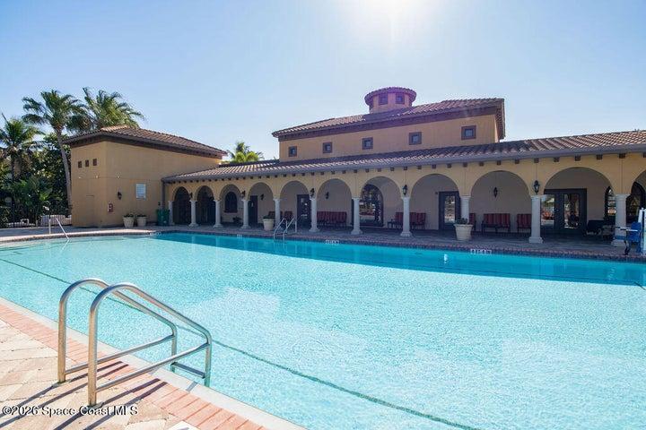 Expansive pool area with covered seating