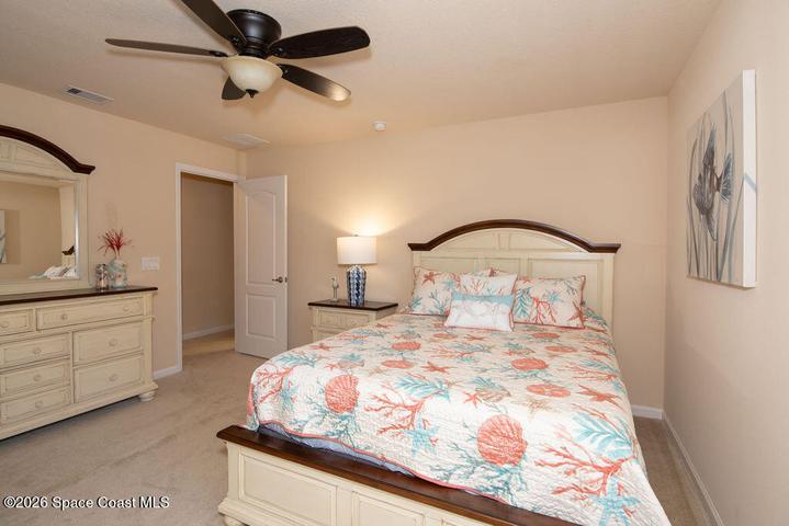 Bright bedroom with neutral tones.
