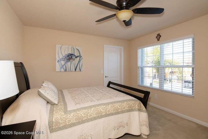 Sunny bedroom with neighborhood views.