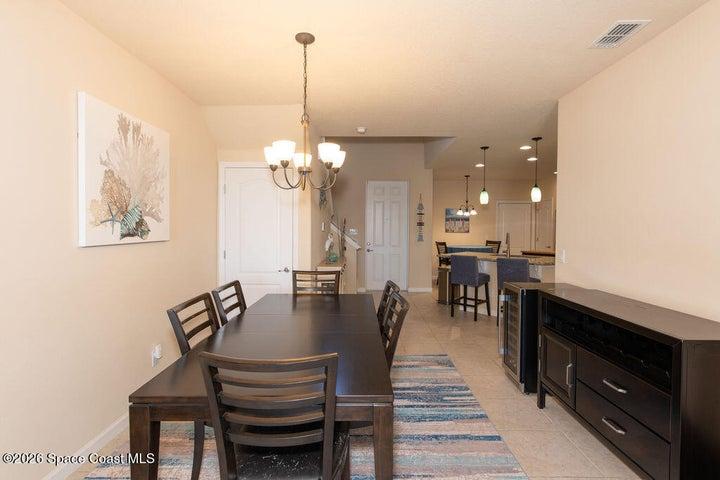 Open-concept dining and kitchen layout.