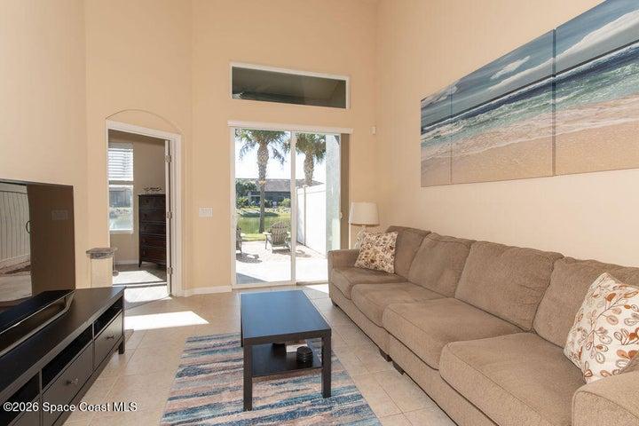 Bright living area with patio access.