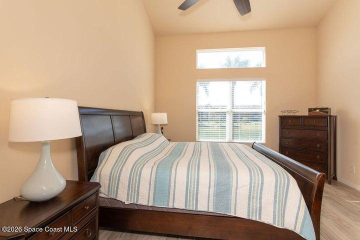 Bright master suite, wood-look flooring