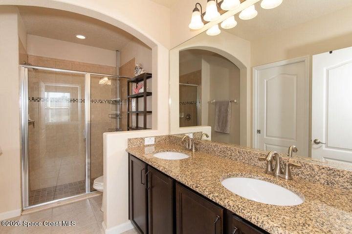 Dual granite vanity, walk-in shower.