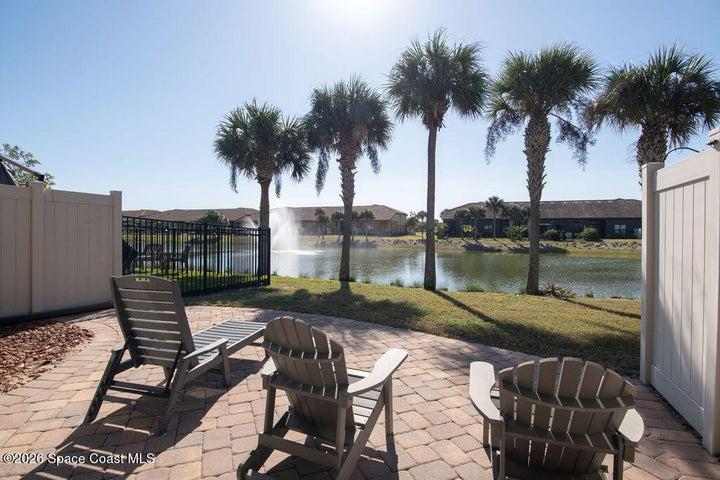 Paver patio with serene water views.