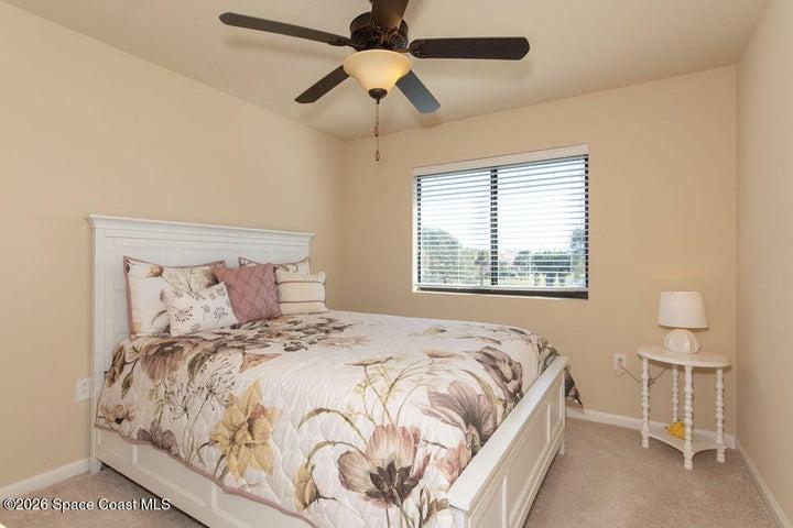 A bright and airy space featuring large windows and neutral tones, perfect for a guest room, home office, or hobby space.