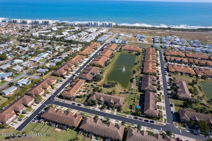This high-altitude view perfectly illustrates the home's premier location, showing just how close you are to the pristine sands and crashing waves of the Atlantic Ocean.
