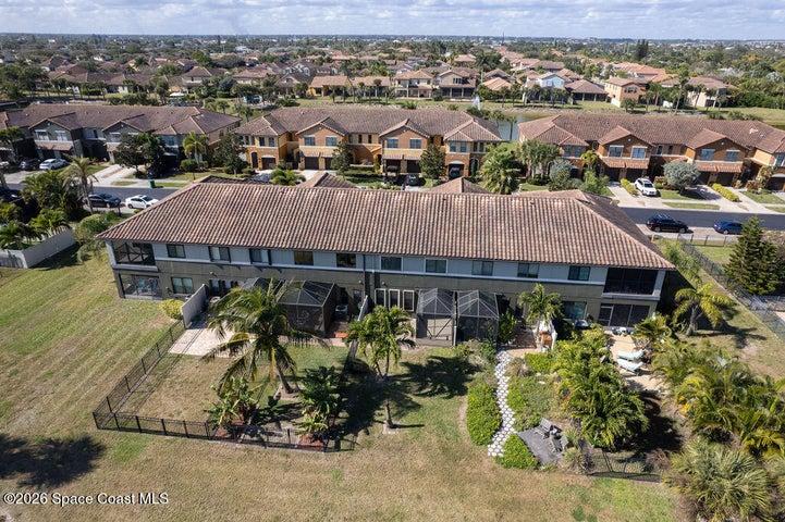 An overhead view of the serene community layout, showcasing the beautifully integrated lake and fountain features that define this neighborhood.