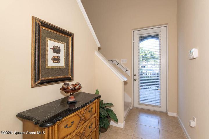 Step inside to a light-filled foyer that immediately showcases the home's open and airy feel.