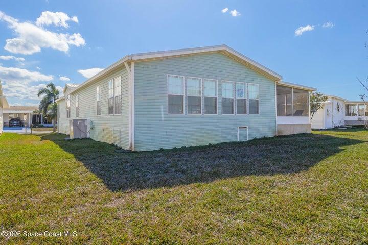 back of house with water view