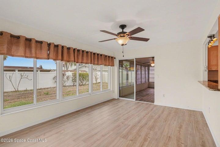Dining area leads into sunroom