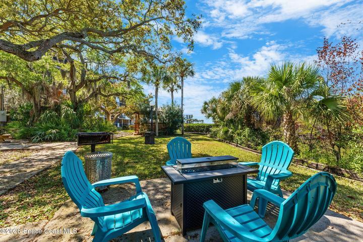 Waterfront Fire Pit at Treasure Island Club overlooking the canal and Banana River.