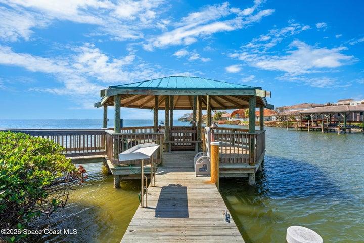 Covered waterfront gazebo at Treasure Island Club overlooking the canal and Banana River.