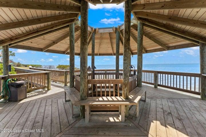 Covered waterfront gazebo at Treasure Island Club overlooking the canal and Banana River.