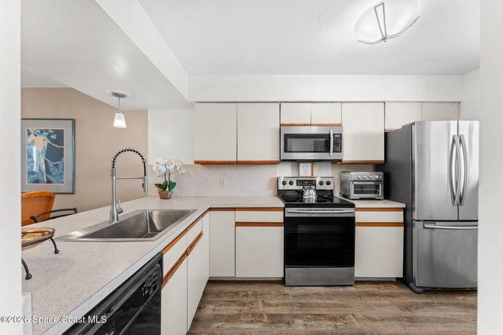 The breakfast bar connects the kitchen to the main living area and provides additional casual seating.