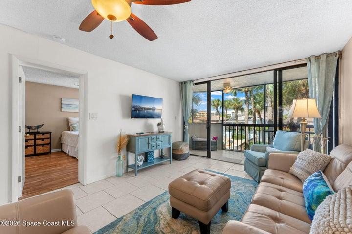 Spacious living room at 300 Columbia Drive Unit 3204 with natural light and views toward the water.