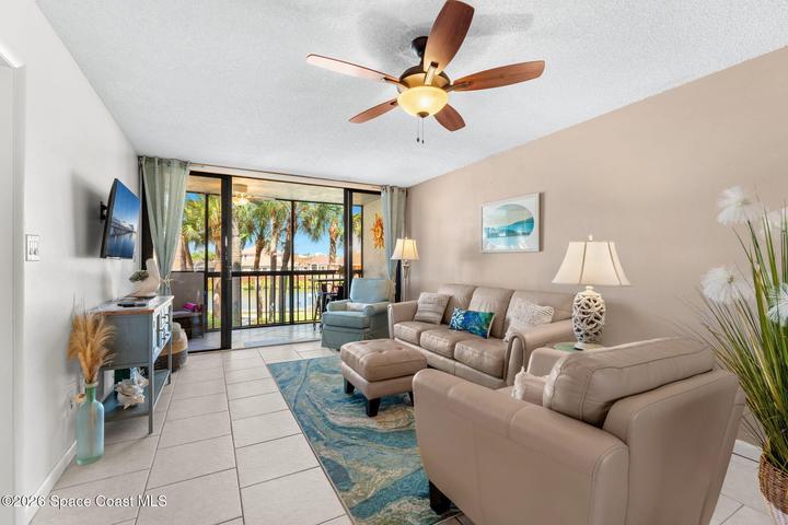Spacious living room at 300 Columbia Drive Unit 3204 with natural light and views toward the water.