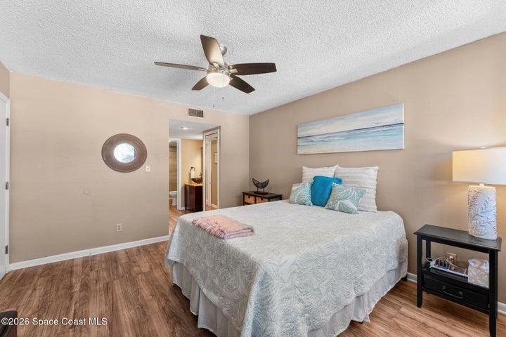Primary bedroom at 300 Columbia Drive Unit 3204 with a walk-in closet and private bathroom.