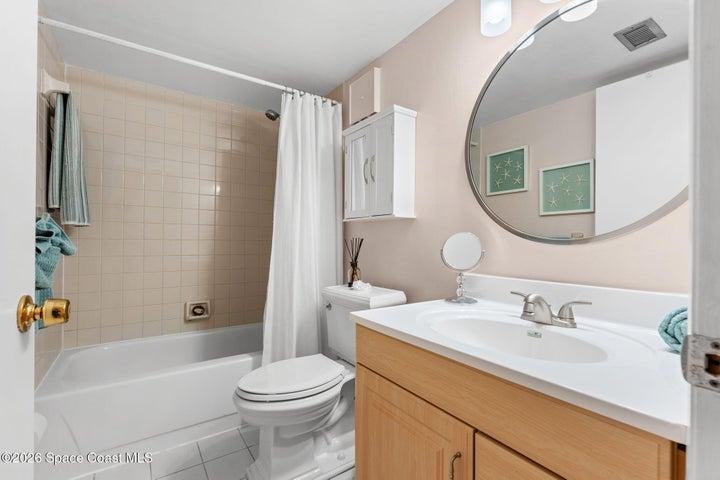 Full guest bathroom conveniently located near the second bedroom and main living area.