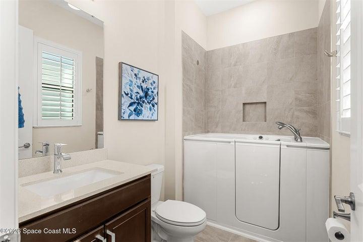 Custom Kohler spa tub in guest bedroom bath.