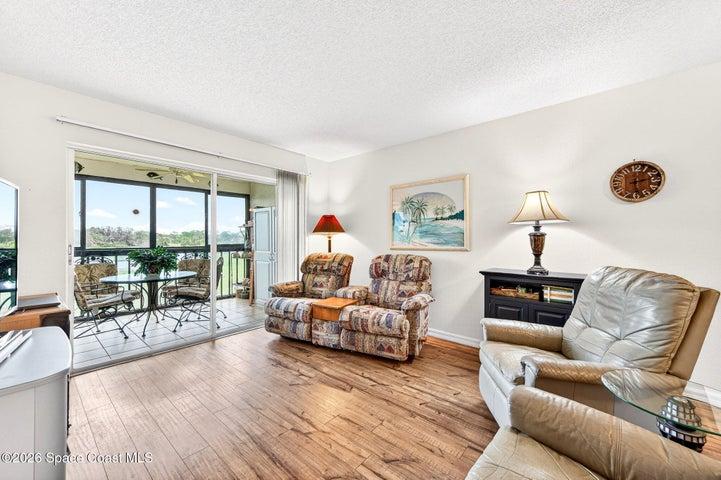 Living Room With Sliders to the Screened Balcony