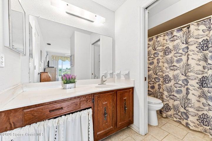 Primary Bathroom - Large Vanity & Private Shower/Toilet Area with Pocket Door
