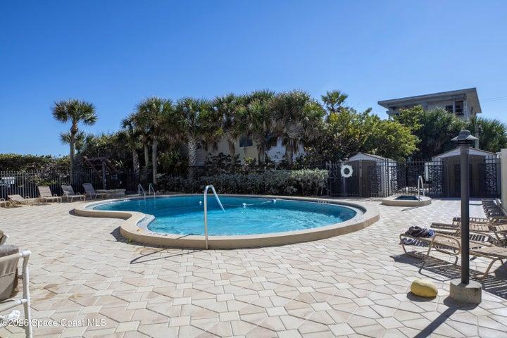 Heated pool and jucuzzi leads out to private beach access.