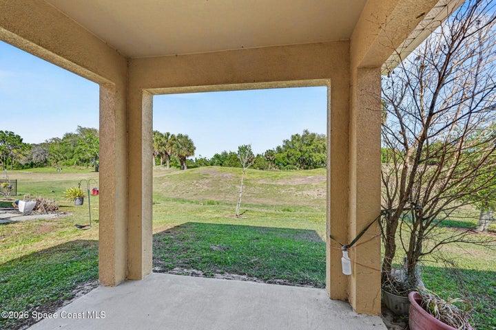 covered back porch with gold course views