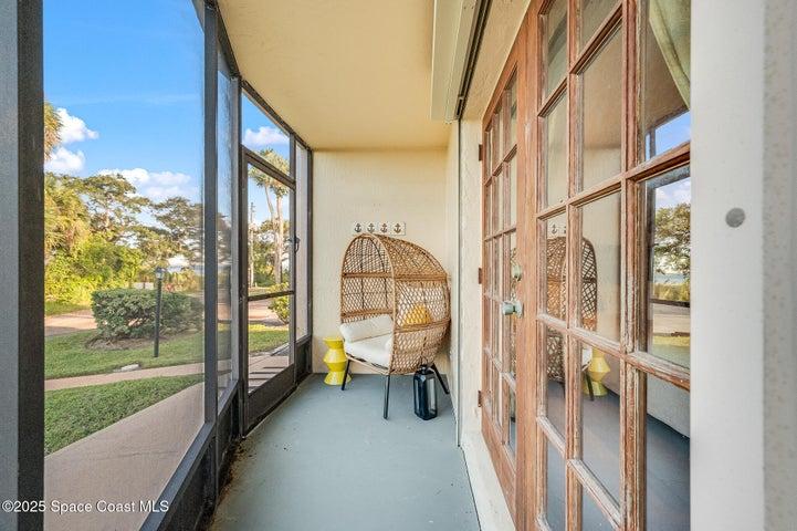 Primary en suite with private screened lanai with view of water and dock