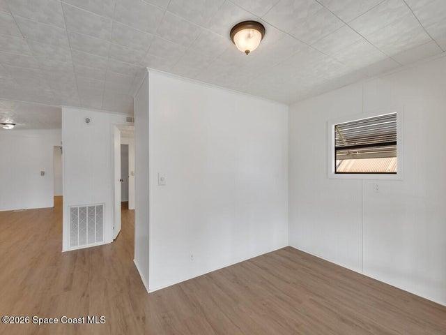 Unfurnished room featuring light wood-type flooring