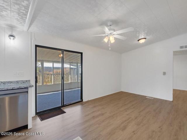 Spare room with light wood-style flooring and ceiling fan