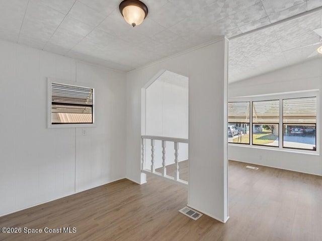 Unfurnished room featuring plenty of natural light and light wood finished floors